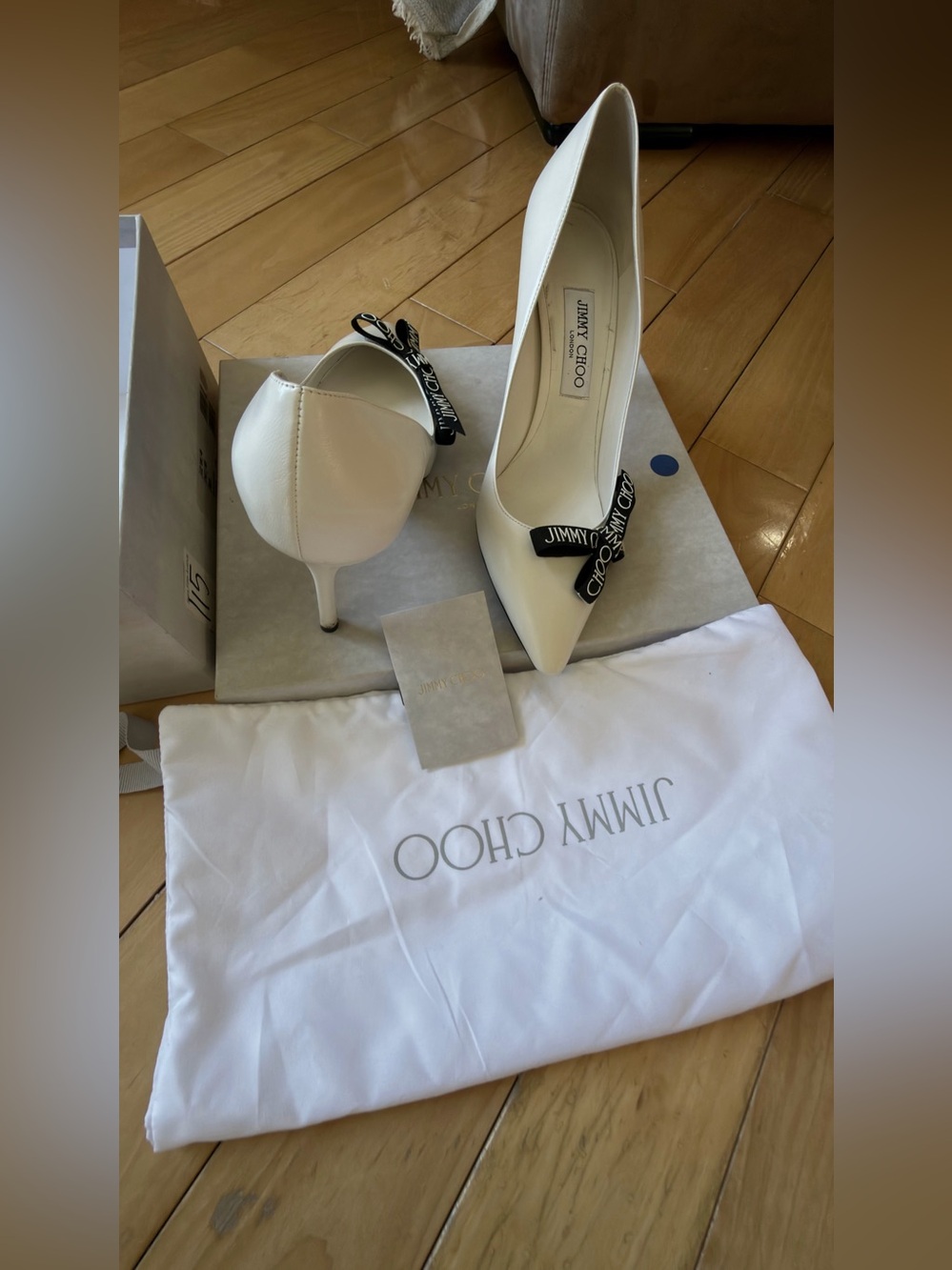 Jimmy Choo Ivory Pointed Toe Pumps with Branded Black Bow